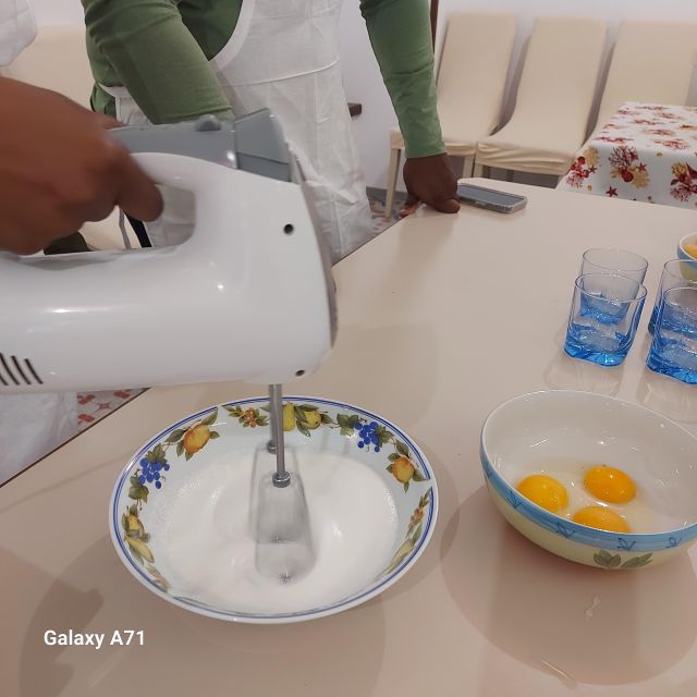 Amalfi: Mozzarella, Fettuccine, and Tiramisù Cooking Class - Rolling tagliatelle with flour, oil, and eggs