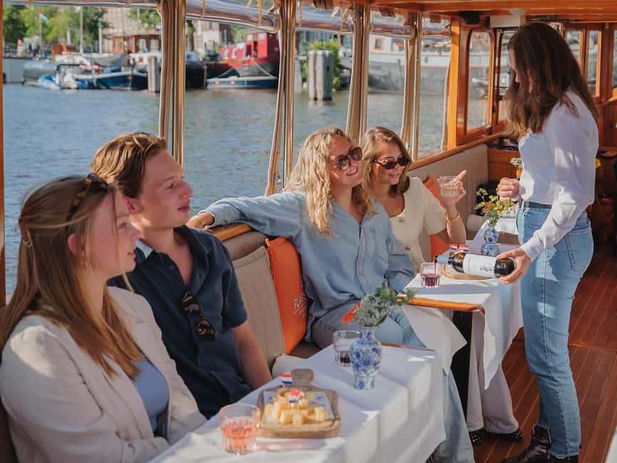 Amsterdam: Classic Saloon Boat Cruise with Cheese & Wine - Choosing between the standard ride and cheese and wine