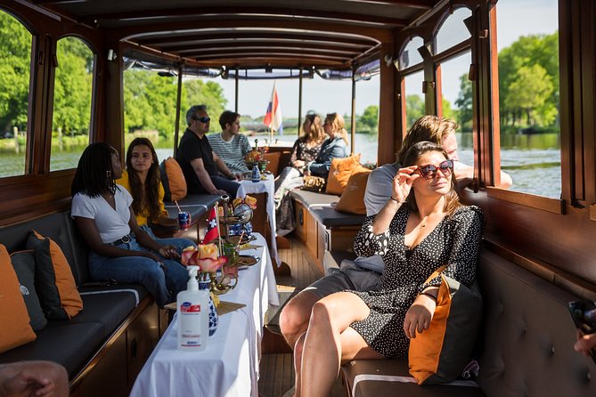 Amsterdam Classic Saloon Boat Cruise with Drinks and Cheese - The canal belts and the unusual bridge views