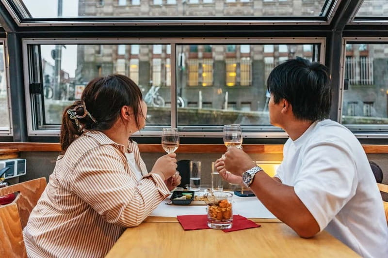Amsterdam: Cozy Cheese & Wine Cruise Tasting Experience - How the crew shapes the evening