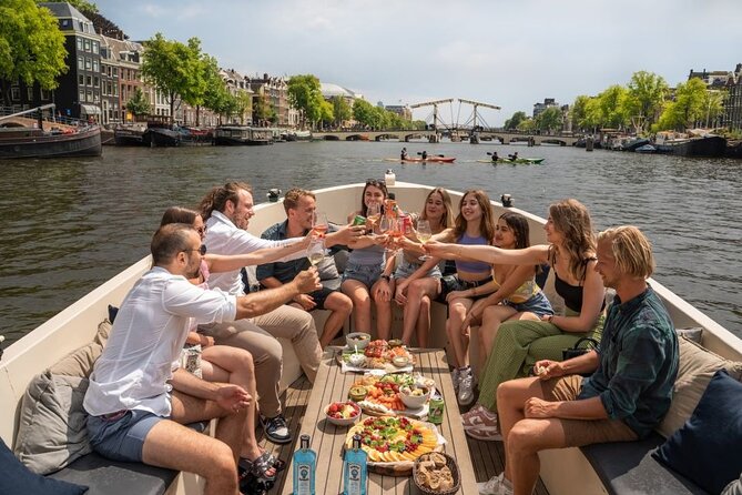 Amsterdam: Evening Candle Light Cruise With Wine & Cheese - Amsterdam by candlelight, with the city reflected in the canals
