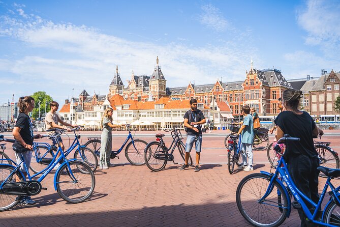 Amsterdam Small-Group Bike Tour With Canal Cruise, Drinks, Cheese - Amsterdam from a bicycle seat and a canal boat