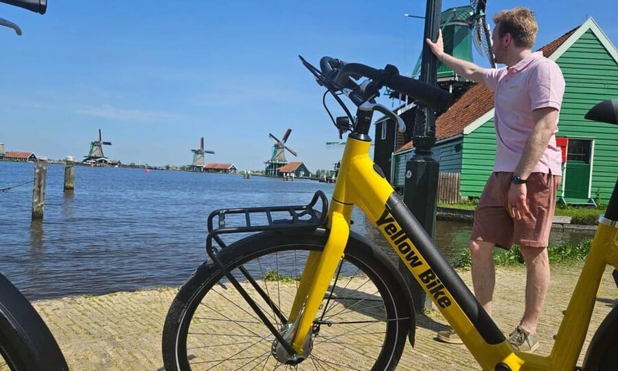 Amsterdam: Zaanse Schans E-Bike Tour with Windmills & Cheese - Leaving Amsterdam by ferry and e-bike