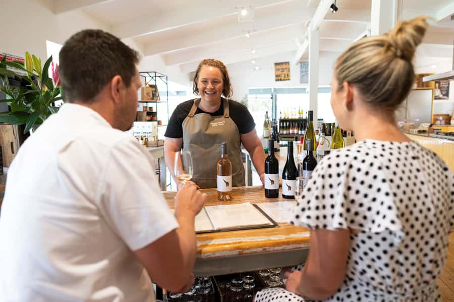 Barossa Valley: Maggie Beer's Wine Tasting & Cheese Platter - A full glass and a cheese platter beside the dam