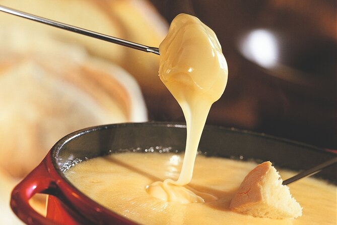 Culinary Tour from Zurich with Traditional Swiss Cheese Fondue Dinner - A welcome drink and a four-course Swiss dinner