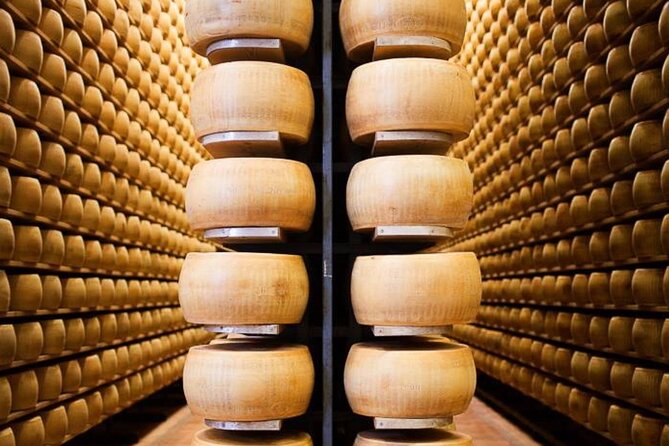 Discover Parma’s Flavors: Parmigiano & Prosciutto Food Tour - Inside a traditional Parmigiano Reggiano caseificio