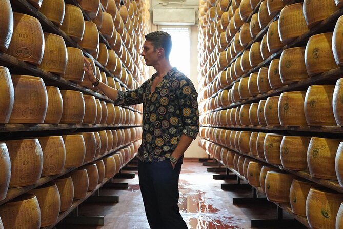 From Parma: Parmigiano Reggiano Farm Tour & Tasting with Transfer - Inside the caseificio, from milk to wheel