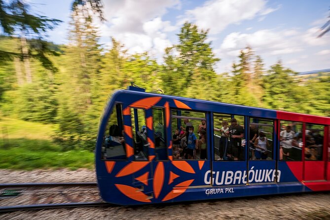 Krakow Zakopane Cable Car Vodka Cheese and Hot Springs Tour - Smoked cheese and local vodka