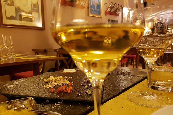 Private 2-Hour Italian Cheese and Wine Tasting in Rome - A private patio or restaurant table in Trastevere