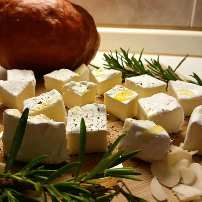 Riga: Old Town Tour with Latvian Wine and Cheese Tasting - Traditional Latvian cheeses on the plate