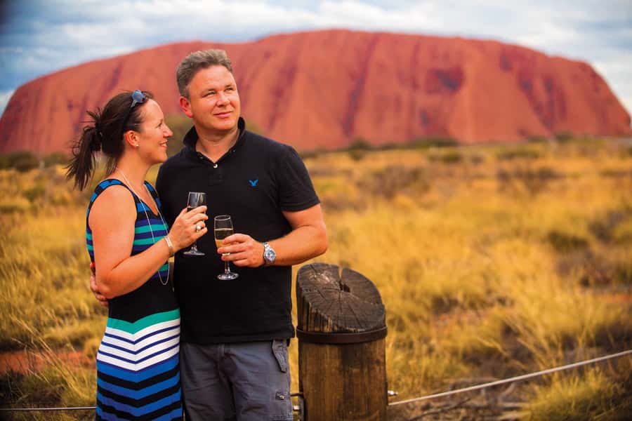 Uluru 1.5-Hour Sunset Tour with Sparkling Wine & Cheeseboard - The first glimpse of Uluru from the coach