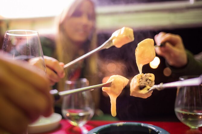 Zurich eTukTuk Private Tour - with Cheese Fondue and Wine - Limmatquai and the Zurich waterfront